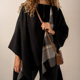 Reversible black poncho.