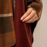 Reversible poncho in burgundy.