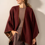 Reversible poncho in burgundy.