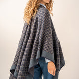 Poncho with blue geometric print.