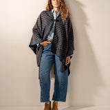 Poncho with blue geometric print.