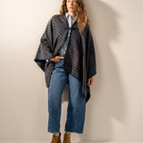 Poncho with blue geometric print.