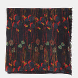 Wool scarf with a black floral print.