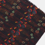 Wool scarf with a black floral print.
