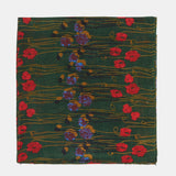 Wool scarf with a green floral print.
