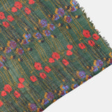 Wool scarf with a green floral print.